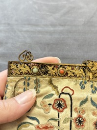 A Chinese embroidered silk purse with red coral- and turquoise-inlaid gilt-bronze mounts, Qing