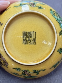 A Chinese yellow-ground aubergine and green-enamelled 'dragon' saucer, Daoguang mark and of the period