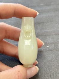 A Chinese white jade snuff bottle with lion-form handles, 19th C.