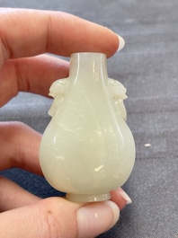 A Chinese white jade snuff bottle with lion-form handles, 19th C.