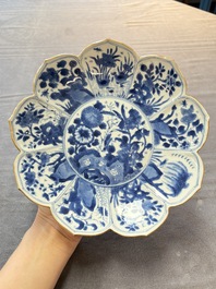 A pair of Chinese blue and white lotus-form 'grasshopper' plates, Kangxi