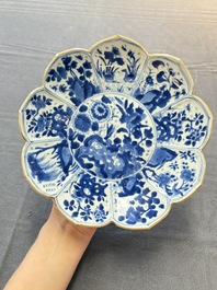 A pair of Chinese blue and white lotus-form 'grasshopper' plates, Kangxi