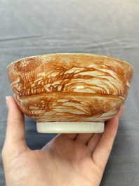 A Chinese iron-red-decorated 'Deer Hunting' bowl and two cups, Qianlong