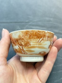 A Chinese iron-red-decorated 'Deer Hunting' bowl and two cups, Qianlong