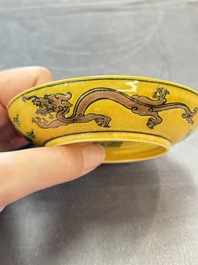 A Chinese yellow-ground aubergine and green-enamelled 'dragon' saucer, Daoguang mark and of the period