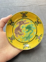 A Chinese yellow-ground aubergine and green-enamelled 'dragon' saucer, Daoguang mark and of the period