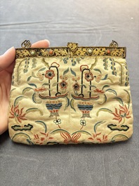 A Chinese embroidered silk purse with red coral- and turquoise-inlaid gilt-bronze mounts, Qing