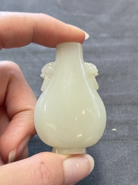 A Chinese white jade snuff bottle with lion-form handles, 19th C.