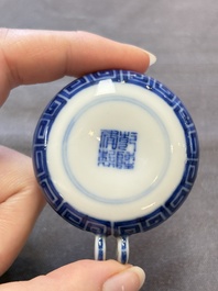 A fine Chinese archaistic blue and white bird feeder with chilong design, Qianlong mark and of the period