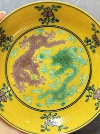 A Chinese yellow-ground aubergine and green-enamelled 'dragon' saucer, Daoguang mark and of the period