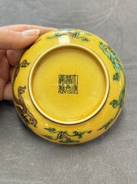 A Chinese yellow-ground aubergine and green-enamelled 'dragon' saucer, Daoguang mark and of the period
