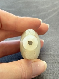 A Chinese white jade snuff bottle with lion-form handles, 19th C.