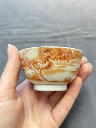 A Chinese iron-red-decorated 'Deer Hunting' bowl and two cups, Qianlong