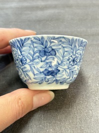 Ten Chinese blue and white cups and eleven saucers, Kangxi