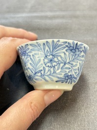 Ten Chinese blue and white cups and eleven saucers, Kangxi