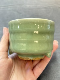 A small Chinese Longquan celadon cylindrical tripod censer, Ming