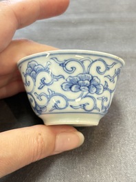 Ten Chinese blue and white cups and eleven saucers, Kangxi