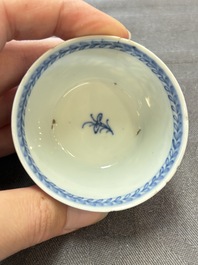 Ten Chinese blue and white cups and eleven saucers, Kangxi
