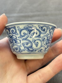 Ten Chinese blue and white cups and eleven saucers, Kangxi
