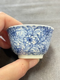 Ten Chinese blue and white cups and eleven saucers, Kangxi