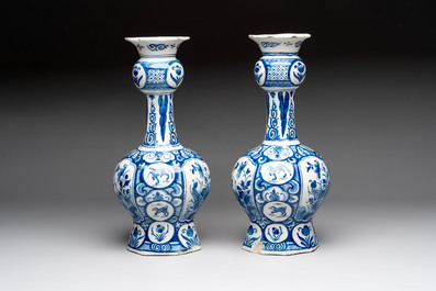 A pair of blue and white Dutch Delft vases with floral design, 18th C.
