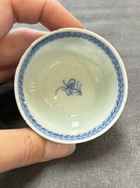 Ten Chinese blue and white cups and eleven saucers, Kangxi