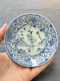 Ten Chinese blue and white cups and eleven saucers, Kangxi