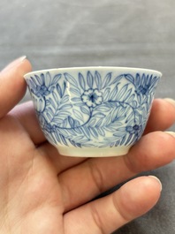 Ten Chinese blue and white cups and eleven saucers, Kangxi