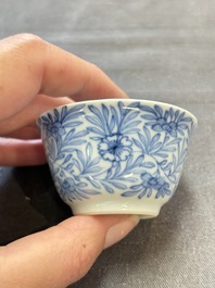 Ten Chinese blue and white cups and eleven saucers, Kangxi