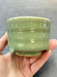 A small Chinese Longquan celadon cylindrical tripod censer, Ming