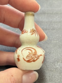 Eight Chinese wucai and gilt-iron-red miniature vases with floral design, Kangxi