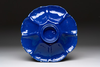 A Nevers white-splashed blue-ground '&agrave; la bougie' dish, France, late 17th C.