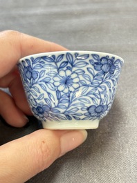 Ten Chinese blue and white cups and eleven saucers, Kangxi