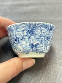 Ten Chinese blue and white cups and eleven saucers, Kangxi