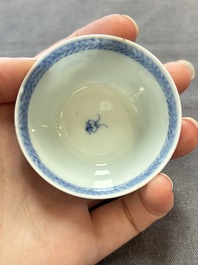 Ten Chinese blue and white cups and eleven saucers, Kangxi