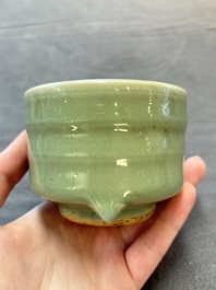 A small Chinese Longquan celadon cylindrical tripod censer, Ming