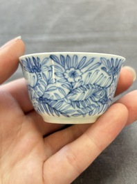 Ten Chinese blue and white cups and eleven saucers, Kangxi