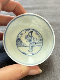 Ten Chinese blue and white cups and eleven saucers, Kangxi