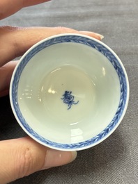 Ten Chinese blue and white cups and eleven saucers, Kangxi