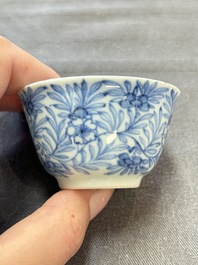 Ten Chinese blue and white cups and eleven saucers, Kangxi