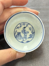Ten Chinese blue and white cups and eleven saucers, Kangxi