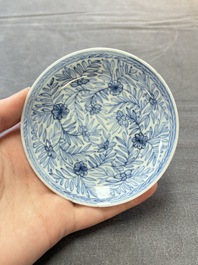 Ten Chinese blue and white cups and eleven saucers, Kangxi