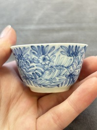 Ten Chinese blue and white cups and eleven saucers, Kangxi