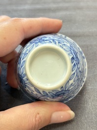 Ten Chinese blue and white cups and eleven saucers, Kangxi