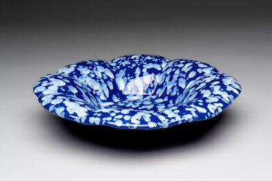 A Nevers white-splashed blue-ground '&agrave; la bougie' dish, France, late 17th C.