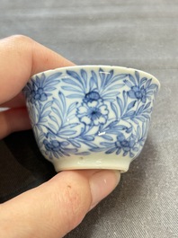 Ten Chinese blue and white cups and eleven saucers, Kangxi