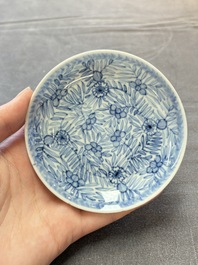 Ten Chinese blue and white cups and eleven saucers, Kangxi