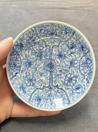 Ten Chinese blue and white cups and eleven saucers, Kangxi