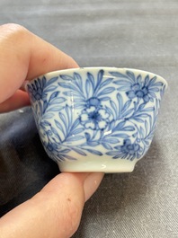 Ten Chinese blue and white cups and eleven saucers, Kangxi