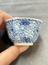 Ten Chinese blue and white cups and eleven saucers, Kangxi